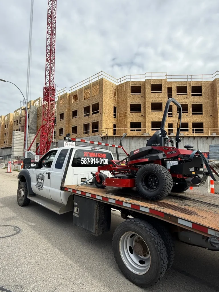 Jim Towing flatbed loaded at a Calgary construction site