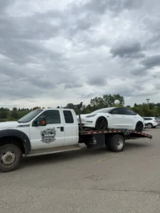 Luxury car loaded on a Jim Towing flatbed