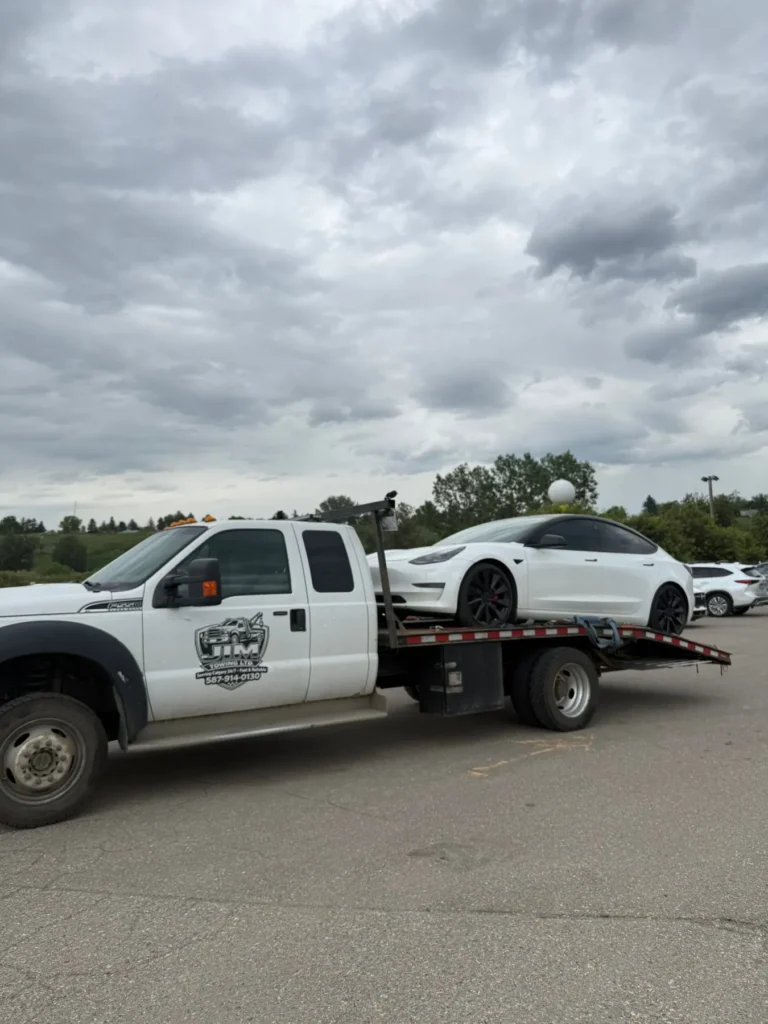 Luxury car loaded on a Jim Towing flatbed